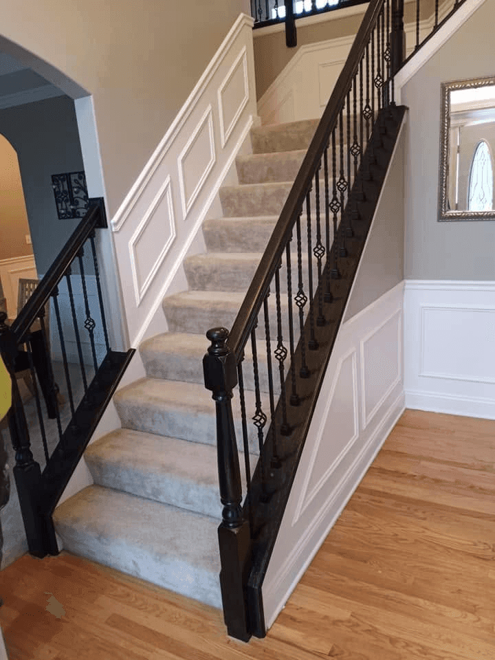 Hardwood Staircase with Ornamental Wrought-Iron Spindles