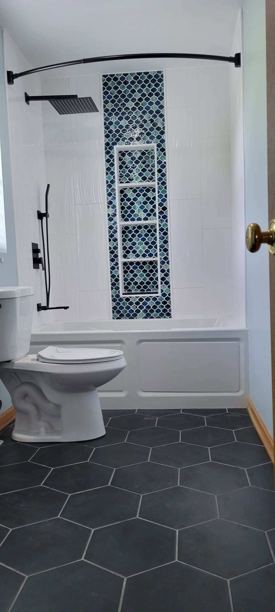 Vertical Subway Surround with Blue Mosaic Shower Niche